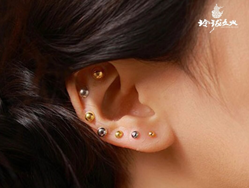 Woman meditating using ear seeds for anxiety relief